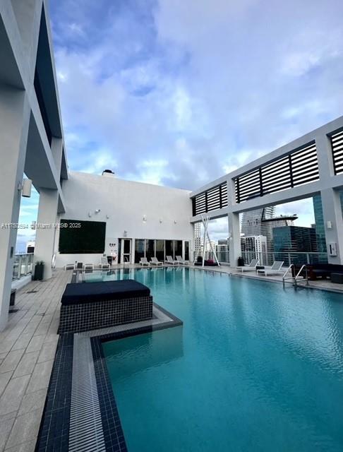 pool featuring a patio area