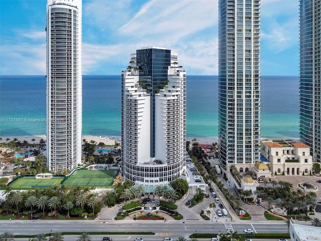 bird's eye view featuring a water view, a city view, and a view of the beach