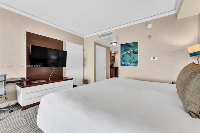 bedroom with visible vents, ornamental molding, and light colored carpet