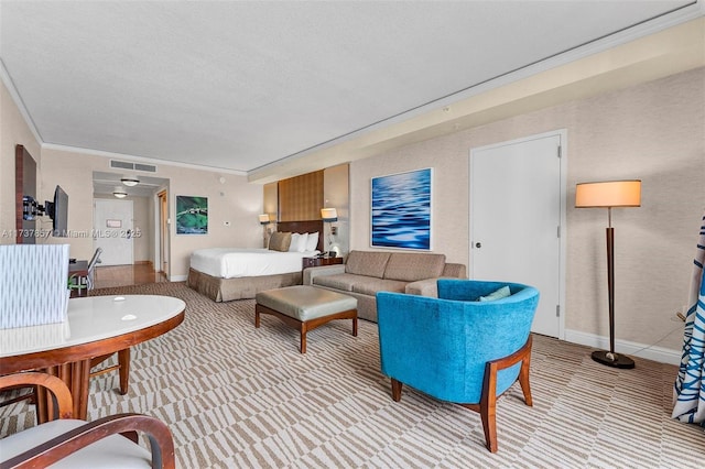 living area featuring a textured ceiling, light carpet, visible vents, baseboards, and ornamental molding