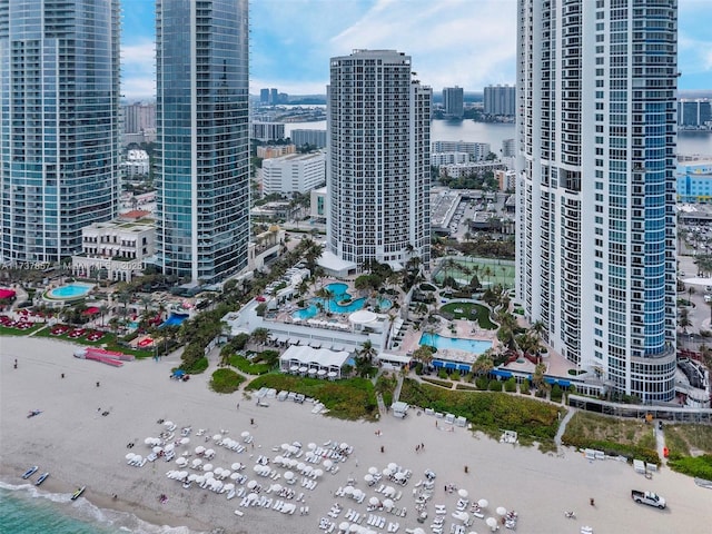 birds eye view of property with a view of city and a water view