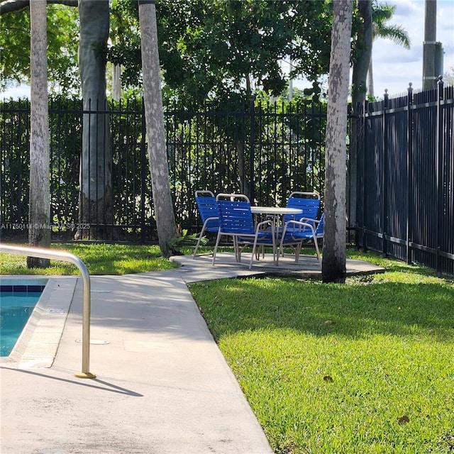 4149 Wimbledon Dr Unit 4149, Cooper City, FL 33026 - view of yard featuring a patio and a swimming pool