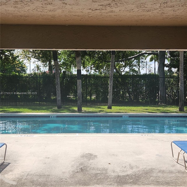 4149 Wimbledon Dr Unit 4149, Cooper City, FL 33026 - view of swimming pool with a patio and a fenced backyard