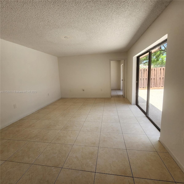 4149 Wimbledon Dr Unit 4149, Cooper City, FL 33026 - empty room featuring a textured ceiling and light tile patterned flooring