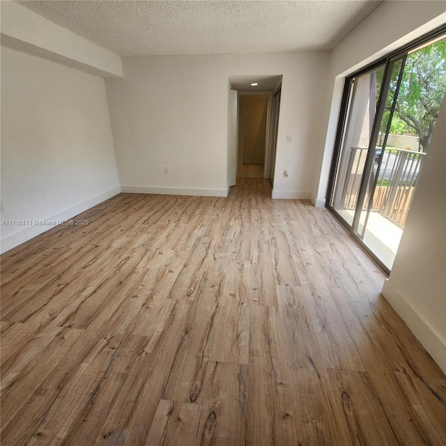 4149 Wimbledon Dr Unit 4149, Cooper City, FL 33026 - unfurnished room featuring wood finished floors, baseboards, and a textured ceiling