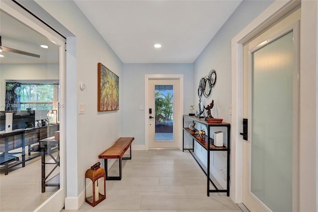 entryway featuring baseboards and recessed lighting