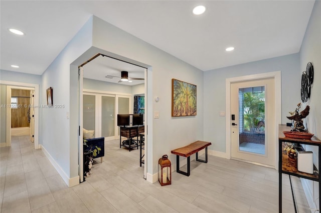 interior space with light wood finished floors, baseboards, and recessed lighting