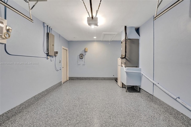 garage featuring baseboards and a garage door opener