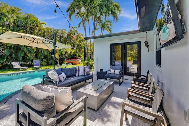 view of patio featuring an outdoor pool, a hot tub, and outdoor lounge area