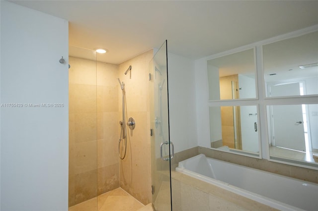 495 Brickell Ave Unit 2102, Miami, FL 33131 - bathroom with a stall shower, visible vents, and a garden tub