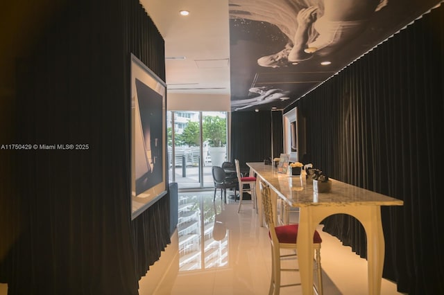 495 Brickell Ave Unit 2102, Miami, FL 33131 - interior space featuring light tile patterned floors, light stone counters, modern cabinets, and dark cabinets