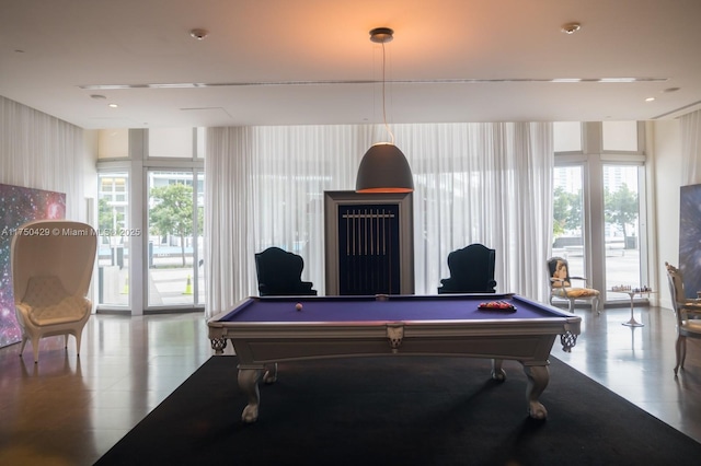 495 Brickell Ave Unit 2102, Miami, FL 33131 - playroom featuring wallpapered walls, billiards, and a healthy amount of sunlight