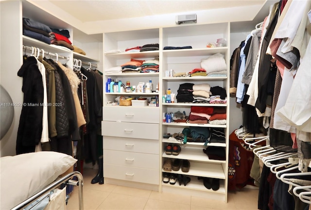 spacious closet with light tile patterned flooring