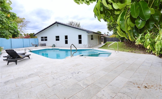 view of pool featuring a patio area, a fenced backyard, and a fenced in pool