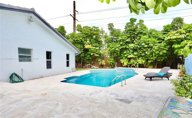 view of pool with a patio, a fenced backyard, and a fenced in pool