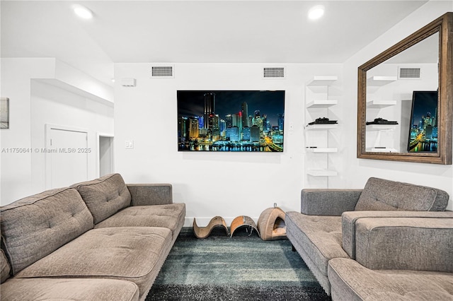 living room with built in shelves, visible vents, and recessed lighting