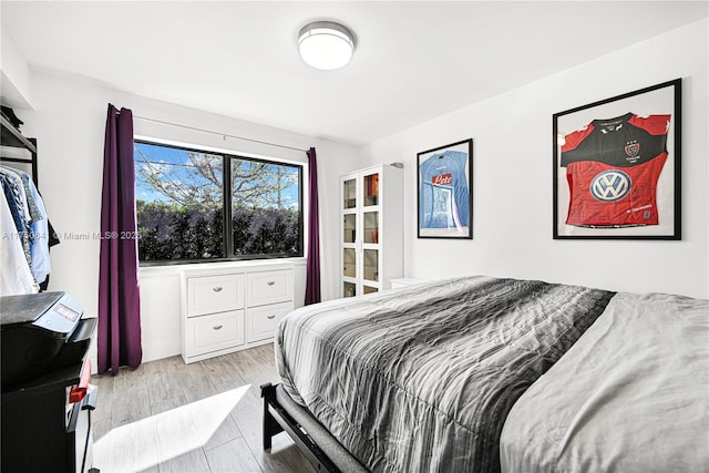 bedroom with wood finished floors