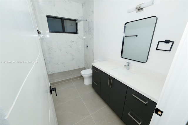 full bathroom with tile patterned flooring, toilet, vanity, and a marble finish shower