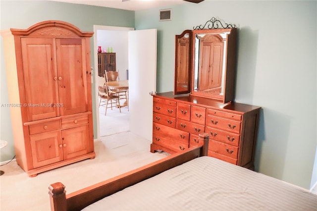 bedroom with carpet floors and visible vents