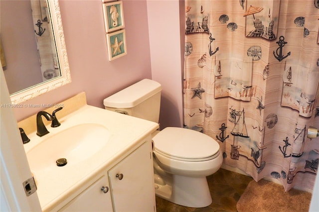 bathroom featuring toilet, curtained shower, tile patterned flooring, and vanity