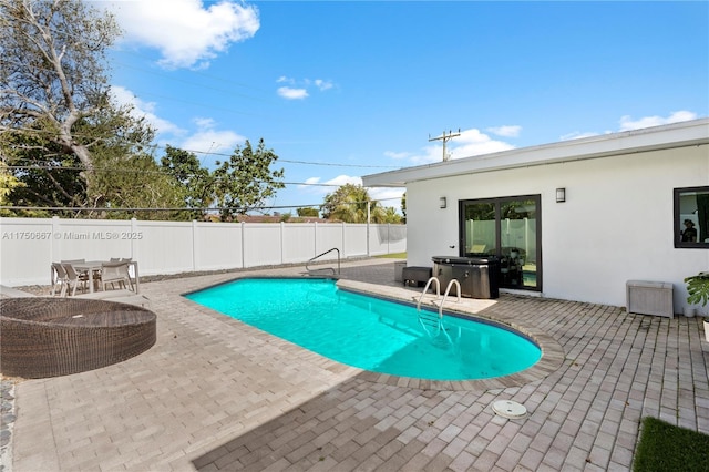 view of swimming pool featuring a patio area, a fenced backyard, and a fenced in pool