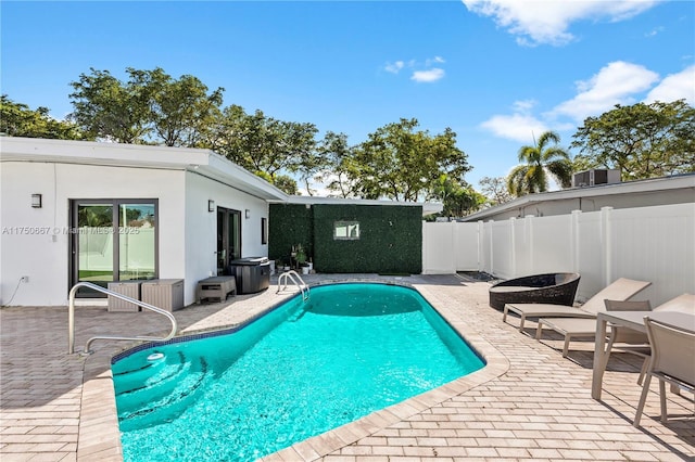 view of swimming pool with a fenced in pool, a patio area, and fence