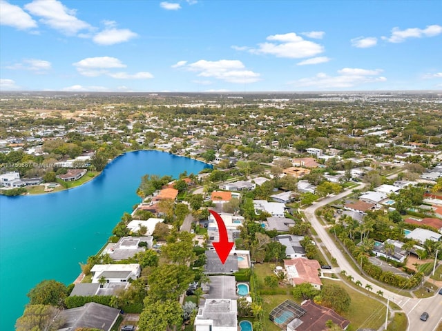 bird's eye view featuring a water view and a residential view