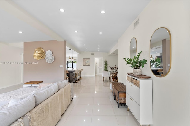 living room with recessed lighting, visible vents, and light tile patterned floors