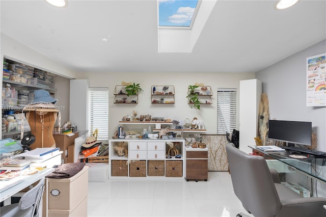 office featuring a skylight and light tile patterned floors