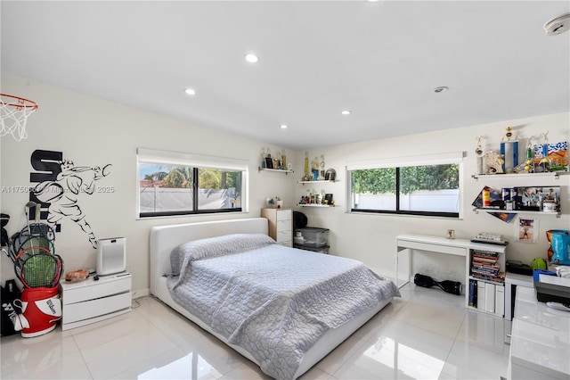 bedroom with recessed lighting, multiple windows, and light tile patterned floors