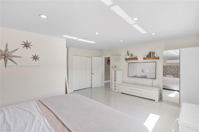 bedroom featuring light tile patterned floors, a wall mounted air conditioner, a closet, and recessed lighting