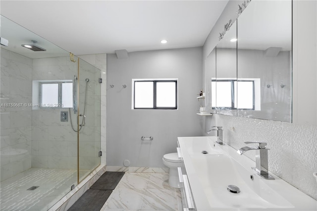 bathroom featuring a stall shower, toilet, marble finish floor, vanity, and recessed lighting