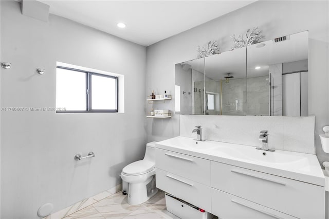 bathroom featuring double vanity, visible vents, toilet, a sink, and a shower stall