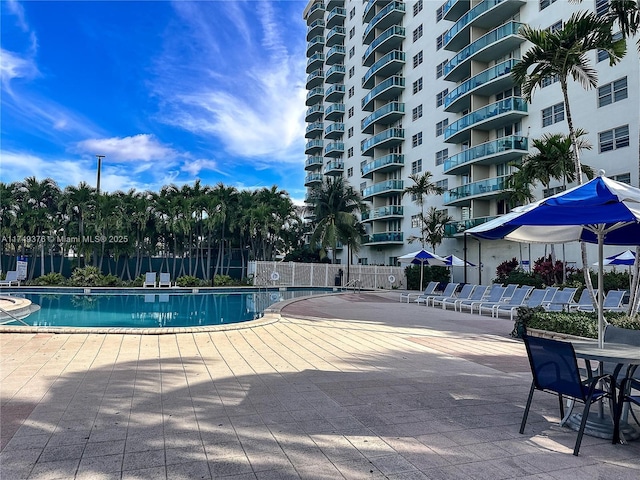 pool featuring a patio area and fence