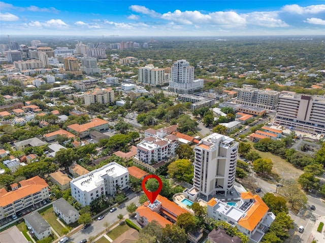 birds eye view of property with a view of city