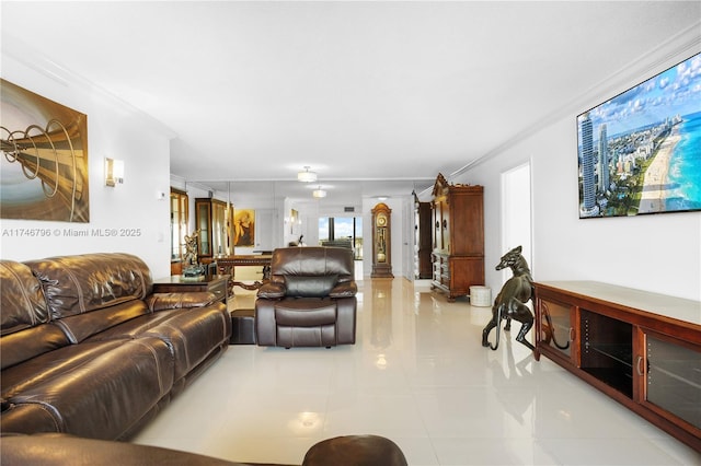 living area with crown molding and light tile patterned floors