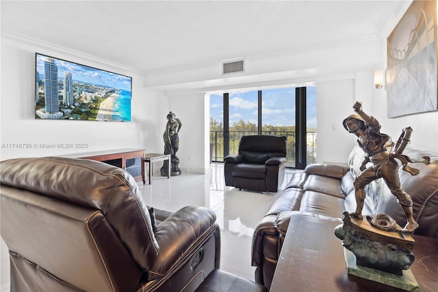 living area featuring visible vents and crown molding