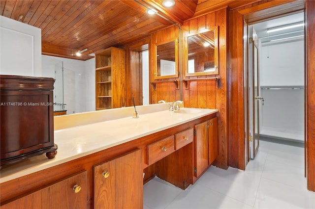 bathroom featuring wood walls, vanity, and wood ceiling