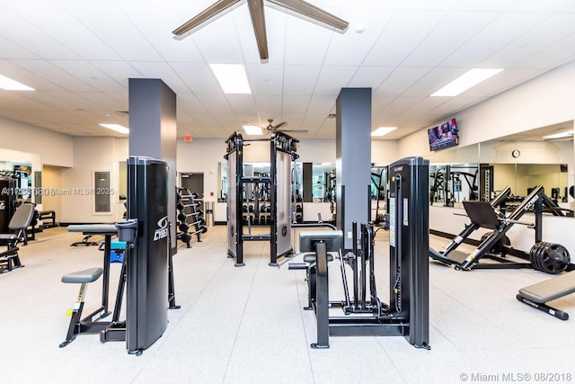 workout area featuring a paneled ceiling