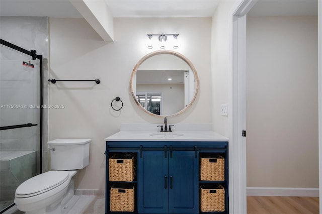 17329 Birchwood Ln Unit A, Fort Myers, FL 33908 - bathroom with baseboards, toilet, wood finished floors, vanity, and a stall shower