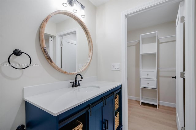 17329 Birchwood Ln Unit A, Fort Myers, FL 33908 - bathroom with baseboards, wood finished floors, and vanity