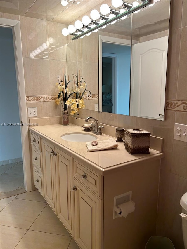 bathroom featuring vanity, tile walls, and tile patterned floors