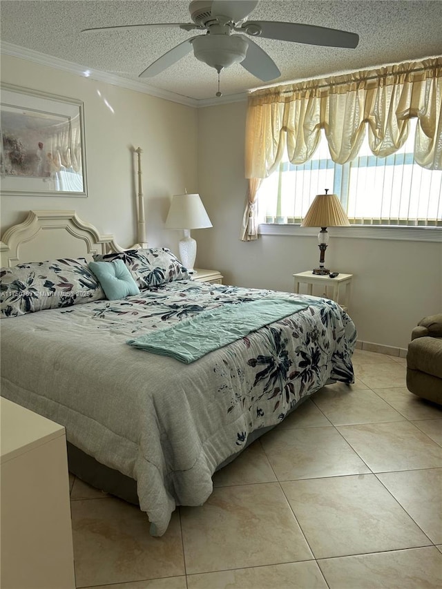 bedroom with ceiling fan, ornamental molding, a textured ceiling, and light tile patterned flooring