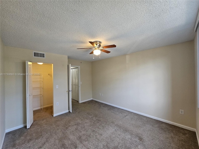 unfurnished bedroom featuring carpet floors, baseboards, visible vents, and a closet