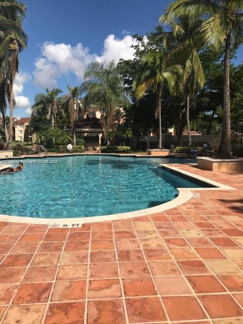 community pool with a patio