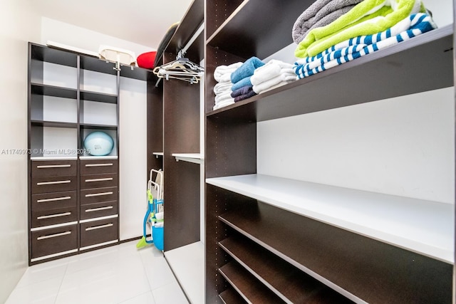 walk in closet featuring light tile patterned floors