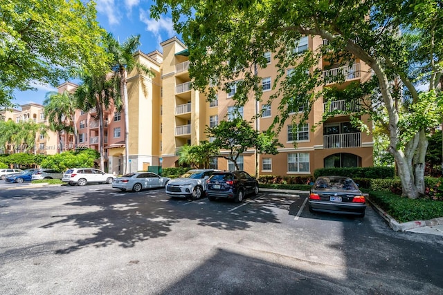 view of property featuring uncovered parking