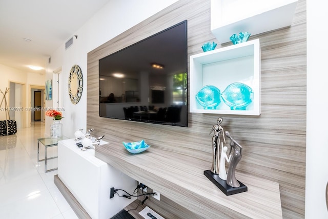 interior space featuring light tile patterned flooring and visible vents