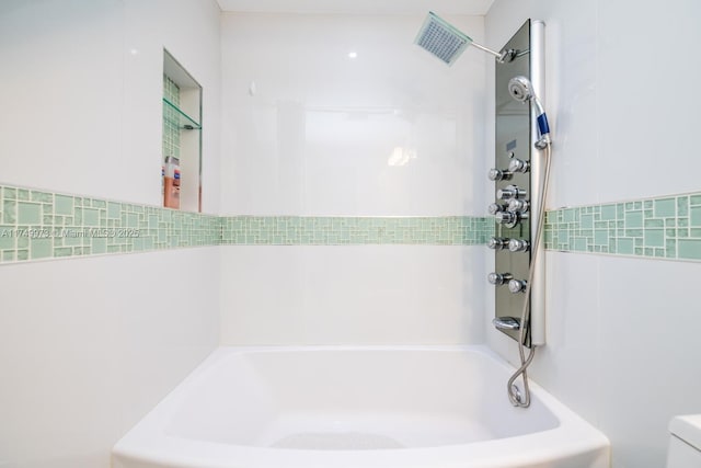 bathroom with shower / bathtub combination, visible vents, and toilet