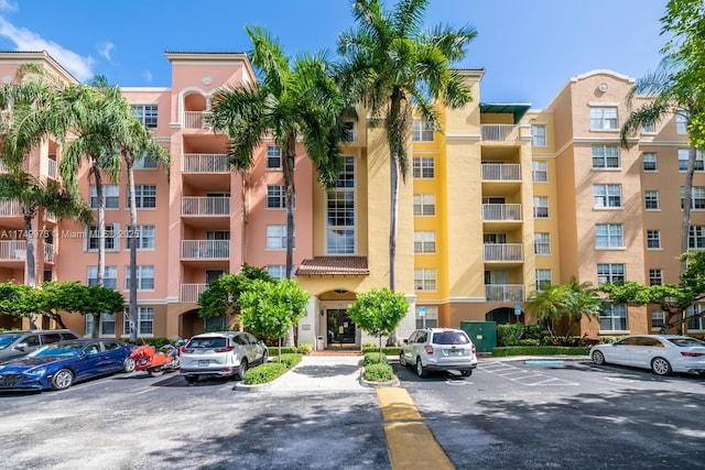 view of property featuring uncovered parking